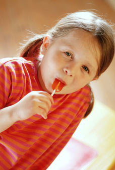 child eating sweets