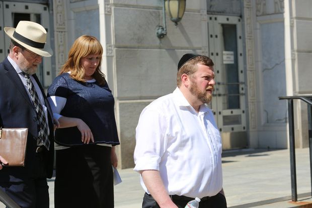 Yocheved and Shimon Nussbaum leave the federal courthouse in Trenton 
