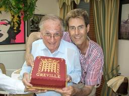 Uri Geller poses with Greville Janner at his 80th birthday party. Note the Andy Warhol "Marilyn Monroe" print on the wall. This picture is from Uri Geller.com. Geller calls Janner an enthusiastic amateur magician and a dear friend.