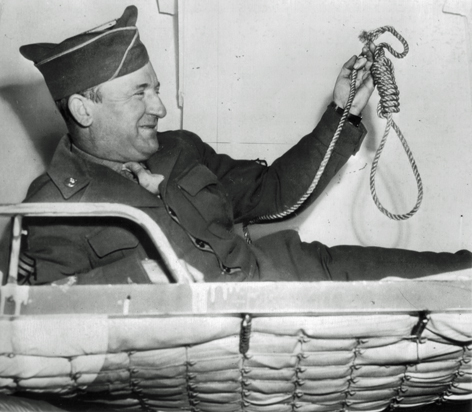 Sergeant John C. Woods poses for photographers in his ship’s bunk