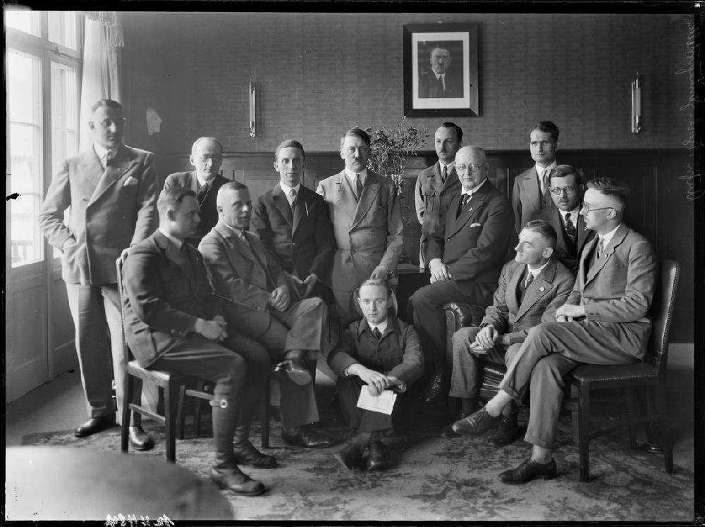 Adolf Hitler surrounded by members of his leadership