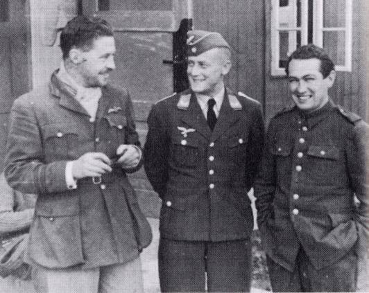 POW Roger Bushell (left) in a congenial conversation with Leutnant Eberhardt (German Security) and Paddy Byrne (fellow POW).