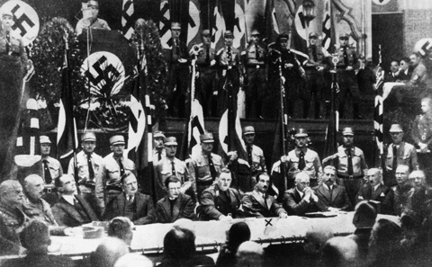 Heidegger shown participating in a meeting, as Rector of Freiburg University