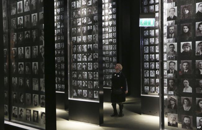 A visitor looks at an exhibit in the Museum of the Second World War