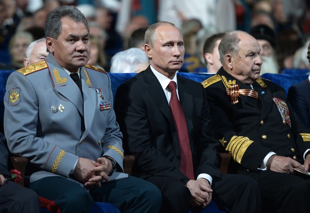 Russian president Vladimir Putin, center, and Defense Minister Sergei Shoigu