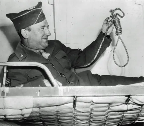 Master Sergeant John C. Woods poses for photographers in his ship’s bunk