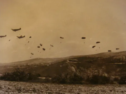 Ju 52s dropping paratroopers.