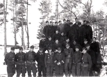 All the men of the 10 Staffel "Red Foxes" pose together in a pretty winter setting; Poldi is 5th from left in front.