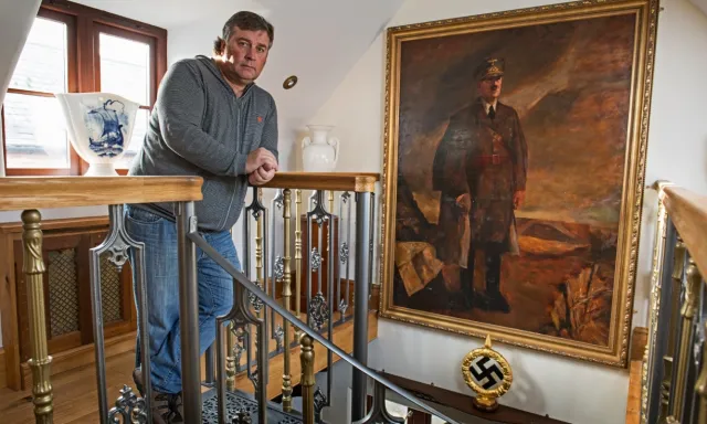 Kevin Wheatcroft stands in his private home in England in 2015